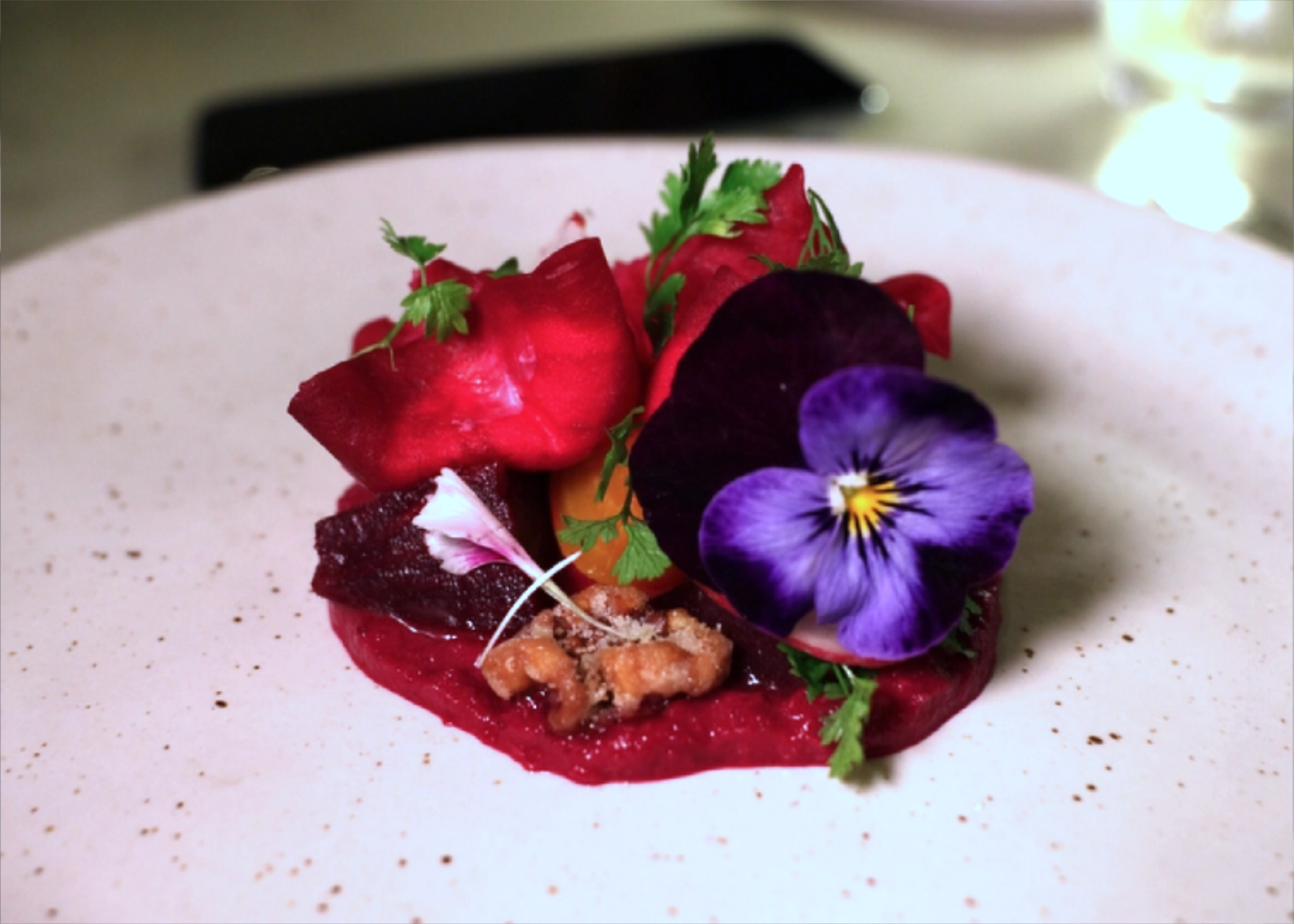 Heirloom beetroots with goats' cheese, candied walnuts and edible flower