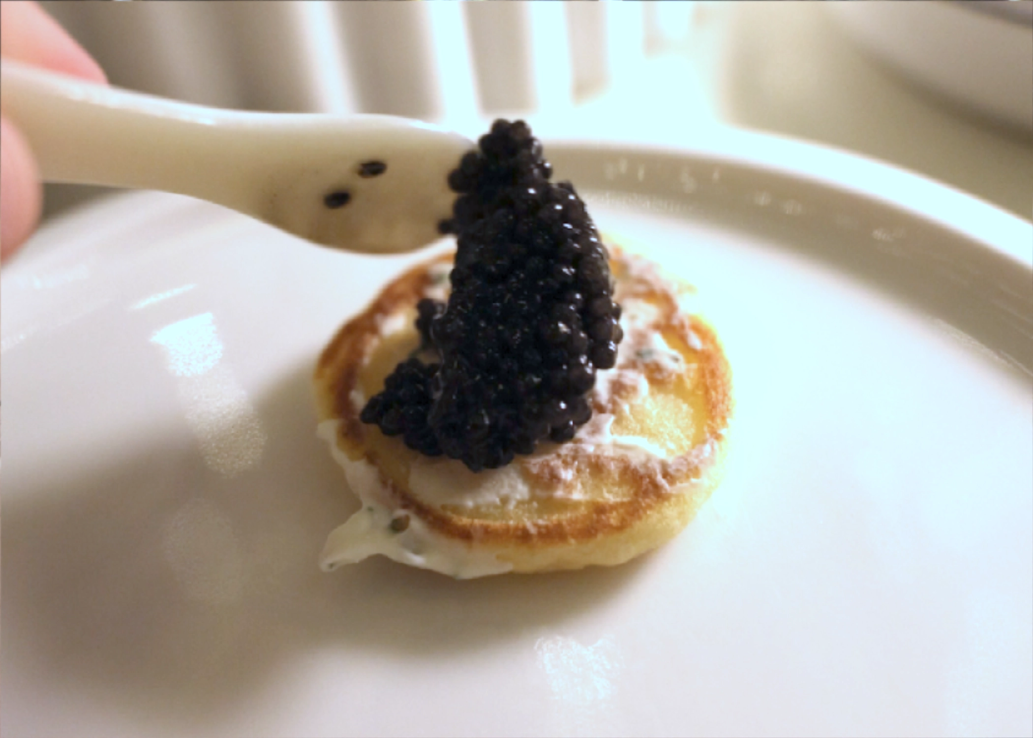 Kaviari caviar with crème fraîche on a blini