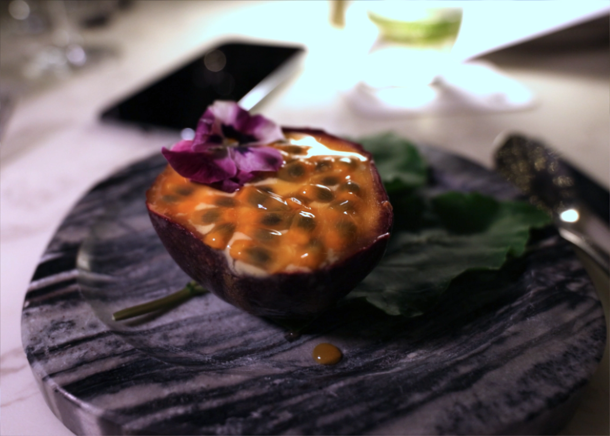 Mango and passion fruit sorbet in passion fruit shell