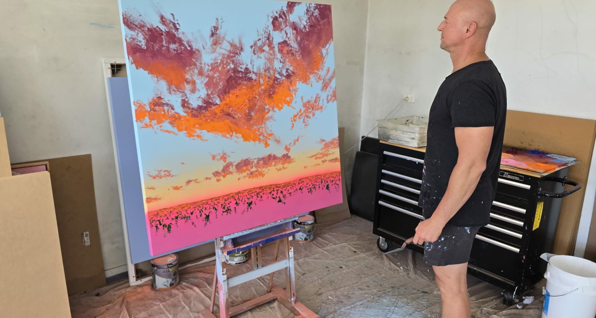 A vibrant contemporary landscape painting by Johnny K featuring thick impasto brushstrokes, magenta and cadmium orange sunset hues, and a soft aerosol sky.