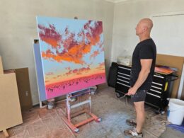 A vibrant contemporary landscape painting by Johnny K featuring thick impasto brushstrokes, magenta and cadmium orange sunset hues, and a soft aerosol sky.