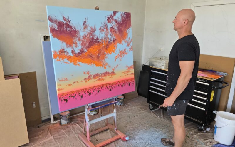 A vibrant contemporary landscape painting by Johnny K featuring thick impasto brushstrokes, magenta and cadmium orange sunset hues, and a soft aerosol sky.