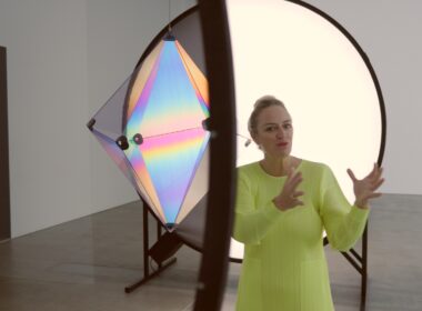 Curator Geraldine Barlow walking through the Olafur Eliasson Presence exhibition at QAGOMA Brisbane, discussing immersive light installations.