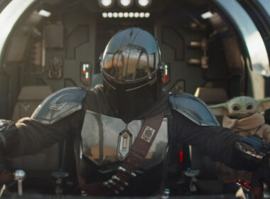 The Mandalorian Din Djarin and his apprentice Grogu in a scene from the Lucasfilm movie The Mandalorian and Grogu.