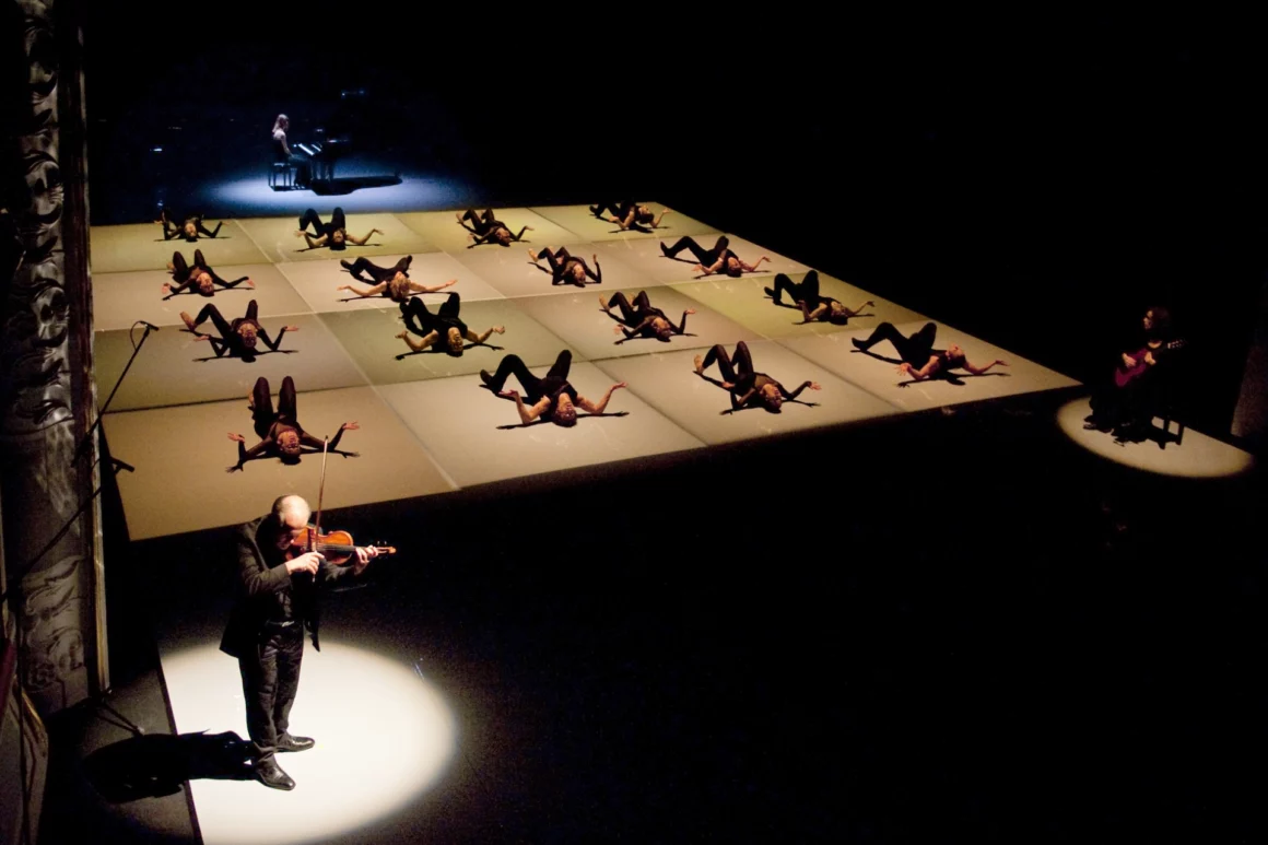 Dancers in Goyo Montero's Chacona for Queensland Ballet's Strings triple bill at QPAC with live musicians.